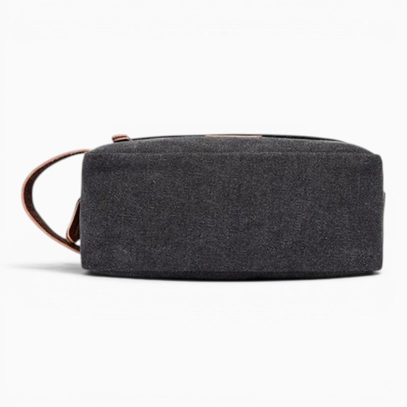 Le Voyage Prestige trousse de toilette en toile grise avec poignée en cuir et fermeture éclair, idéale pour le voyage.